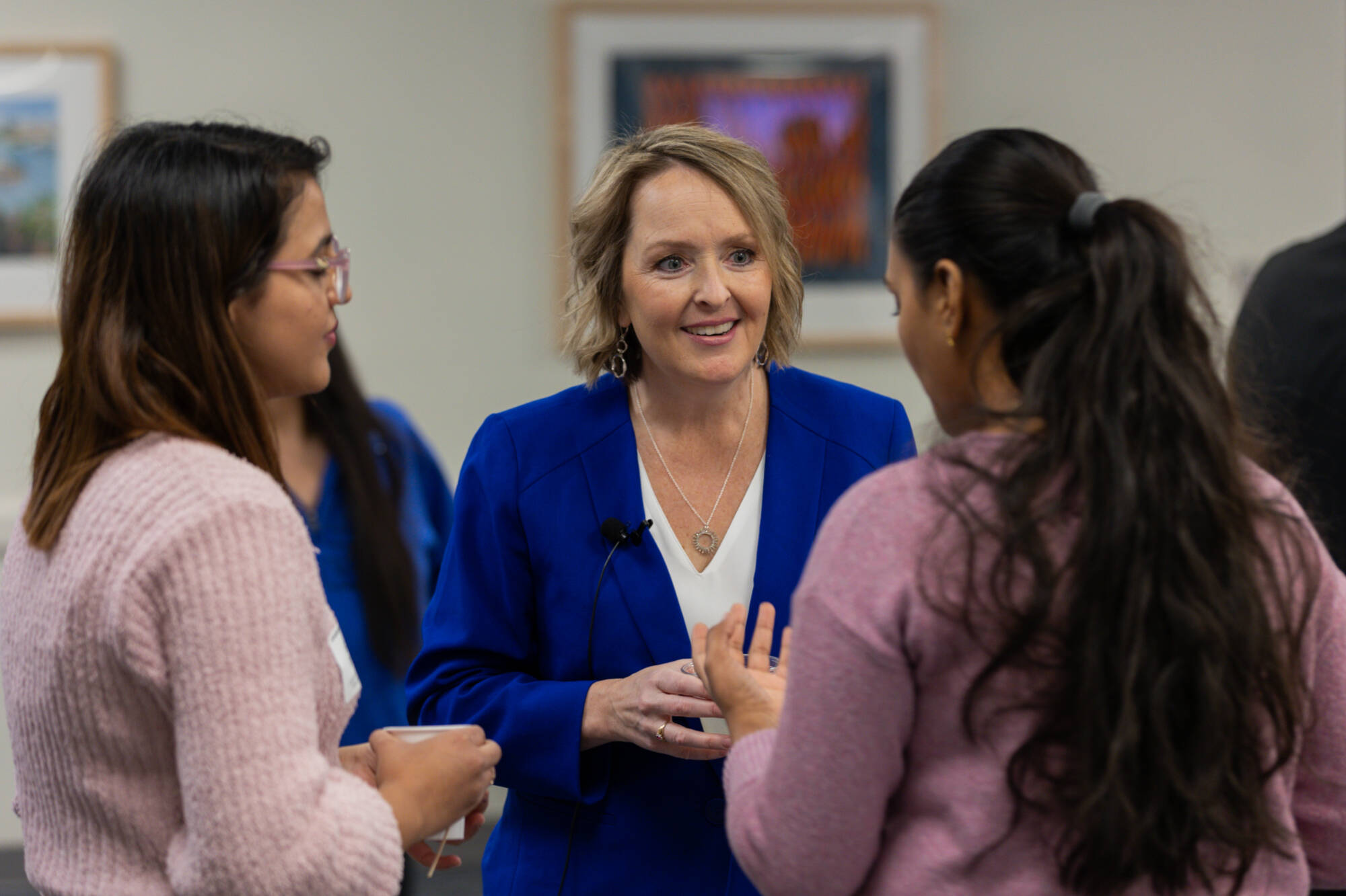 Speaker talking with students